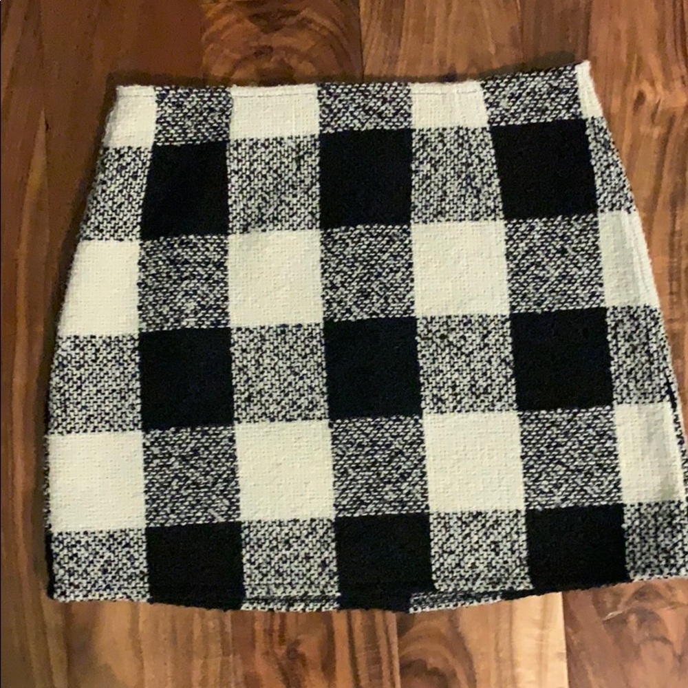 In good condition.Super cute white and black skirt